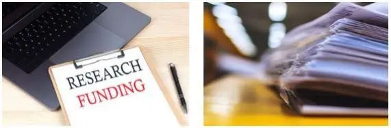 Research proposal page and a stack of papers