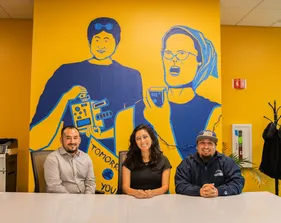 OC3 members sitting at a table in the OC3