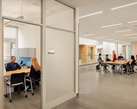 A photo of the BIT building with students and professors in the background