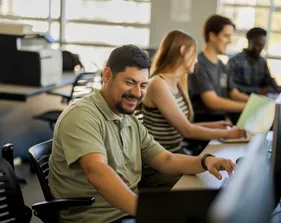 A group of students working in the business and information technology building