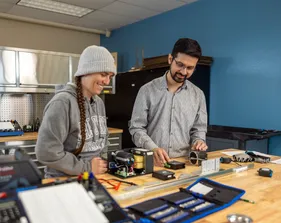 A mechatronics student collaborating with a professor