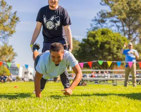 Two MB madness participants run together in a 2 person race