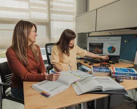 Two accounting professors engage in meaningful discussion