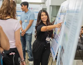 A girl is smiling for a photo