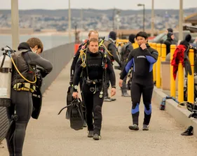 Diver walking and getting ready to enter water