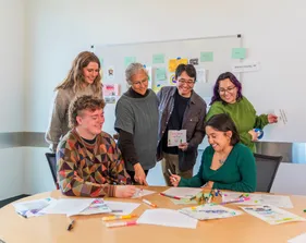 CSUMB environmental science students and faculty review student work together during a collaborative classroom activity.