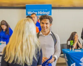 Student talking to an employer at a career fair.