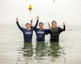 Students posing for picture in the water