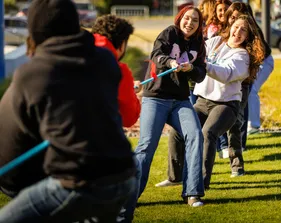 Students participating in a tug of war
