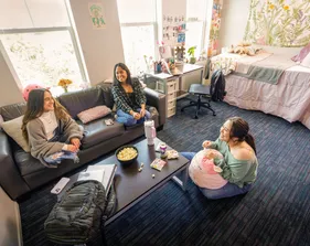 Students chatting in a dorm room