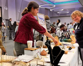 People looking at local goods at Winter Night Market