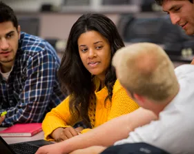 Students sitting together and having a discussion in a classroom