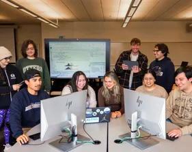A group of students discussing and similing