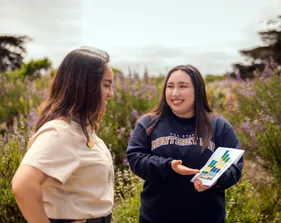 Two girls are smiling