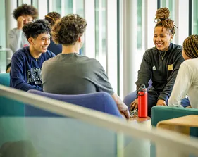Students sitting in the lounge and conversing