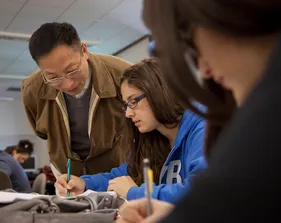 a professor helping a student