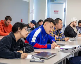 Students in class writing