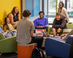 Students sitting in the lounge conversing