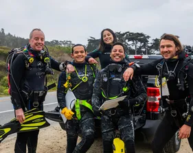 Divers sitting with each other before a dive