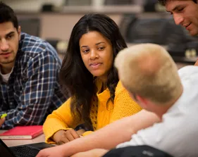 Students sitting together and having a discussion in a classroom