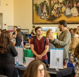 A picture of the career fair with students and employers