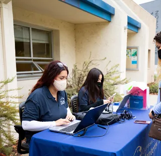Photo: Students tabling and checking in