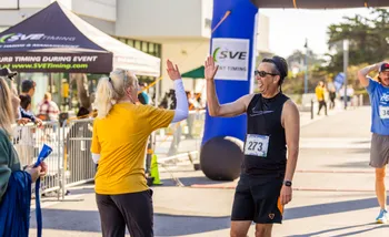 Runners crossing finish line