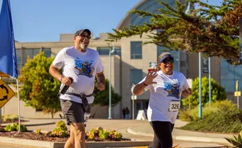 Two runners smiling