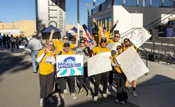 Group of supporters with encouraging signs