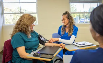 Nursing student practicing