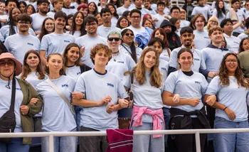 Students linking together at Convocation