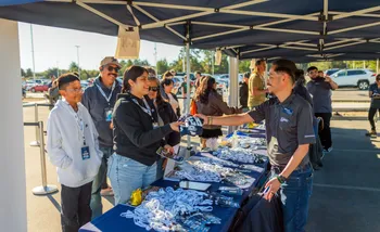Open House staff greet participants