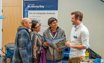 College of Business Professor greets Open House participants