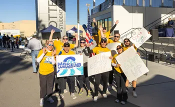 Group of supporters with encouraging signs