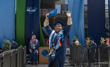 Graduate celebrating at Commencement