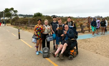 Group of students on recreation path near Otter Plunge with smores