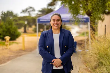 A portrait of someone smiling at the camera