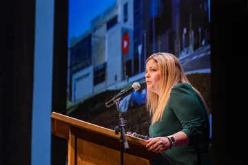 President Vanya Quiñones giving a speech