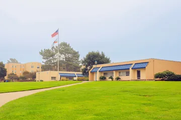 President's office and the flag pole in the center of CSUMB campus