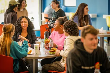 Students sitting at a dining table