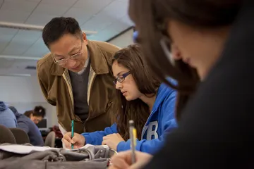 a professor helping a student