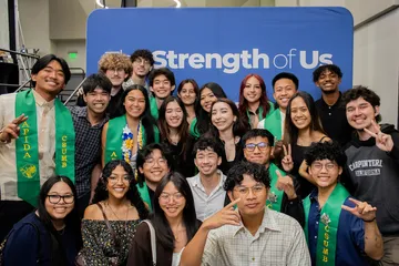 Group of happy students at the APIDA stole ceremony.
