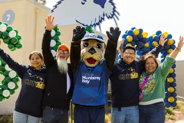 Admitted otter day 2025, new students and parents with Monte celebrating