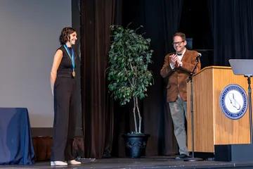 A student receiving an award on stage
