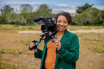CART student holding a camera