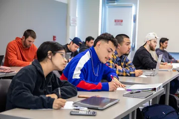 Students in class writing