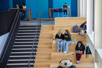 An image of students sitting on the stairs in the OSU