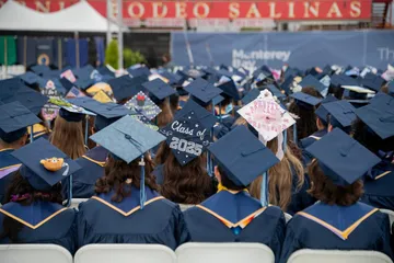 2025 CSUMB Grads sitting at the Commencement ceremony