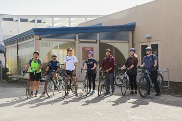 7 students ready to go on a coastal bike ride