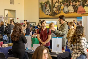 A picture of the career fair with students and employers